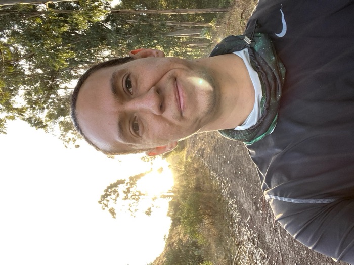 Leland on a trail at golden hour